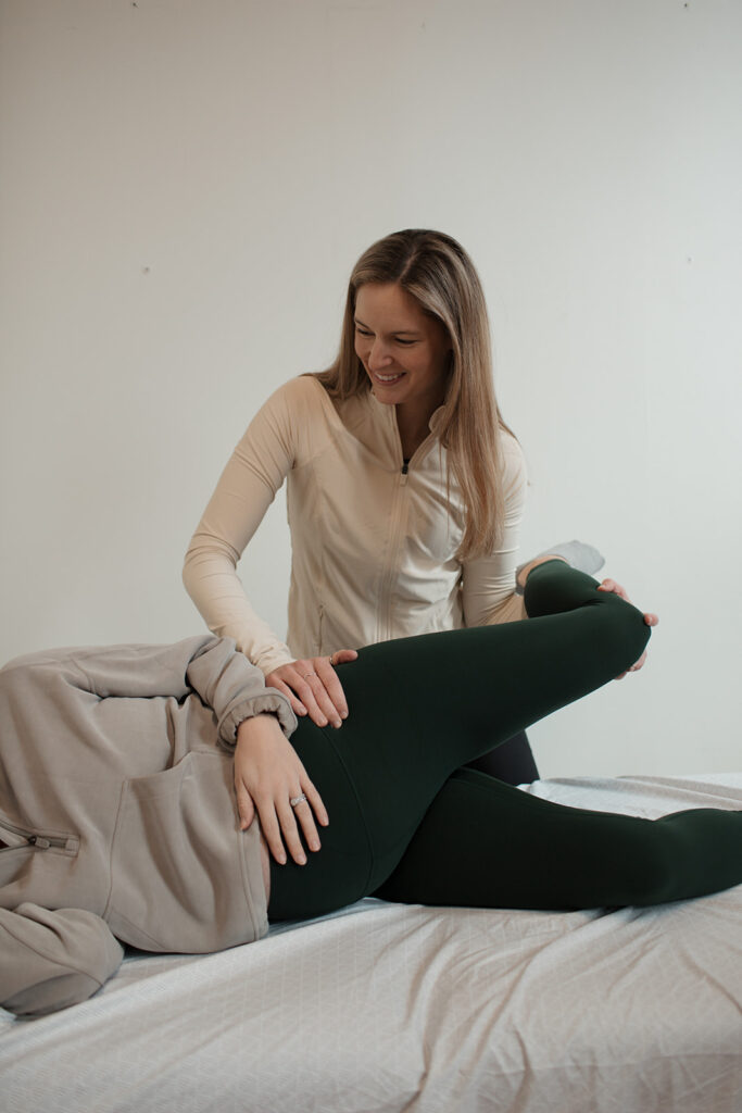 Dr. Brooke doing physical therapy on pregnant woman